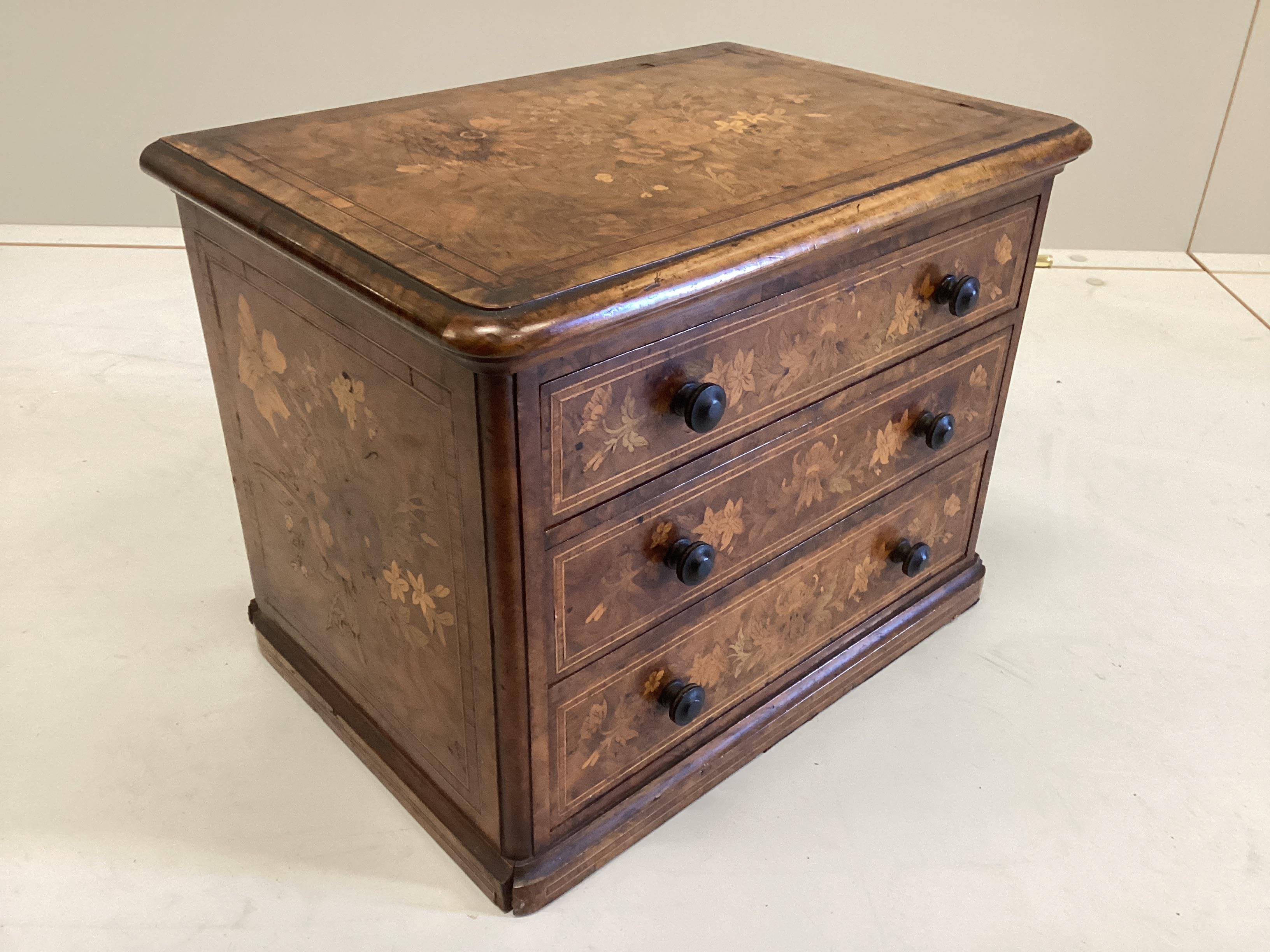 A Victorian floral marquetry inlaid miniature walnut chest, stamped 1863, B Shepherd, width 35cm, depth 24cm, height 27cm